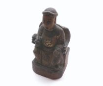 Antiquarian type carved softwood figure depicting a seated Monarch or Cleric on a throne clutching