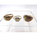 A group of two hallmarked 9ct Gold Signet Rings and yellow metal example, 12 gm total (conditions