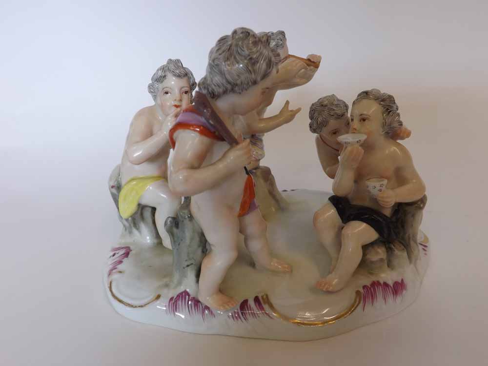 A Meissen Group of five Bacchanalian Putti, each in various poses and painted throughout in colours,