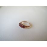 9ct gold three stone ruby ring. Size Q