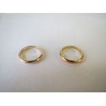 Two gold coloured metal wedding bands. size m/n. 6g