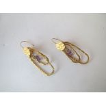 Modern yellow coloured metal designer earrings.  Have been used, fair condition for age and wear