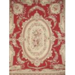 Large Aubusson rug with burgundy and light beige background and floral decoration. L365cm x W256cm