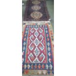 Small Kelim carpet with central stylised cream shapes and terracota and red border designs 175 cm