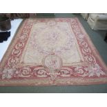 Large Aubusson rug with beige background and burgundy border with floral decoration. L370cm x W267cm