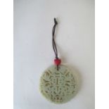 Circular carved jade pendant Fair condition . No obvious sign of damage or repair