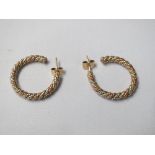 Pair of large hoop earrings in yellow and rose gold coloured metal