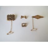 Four gold metal brooches. 12.5g