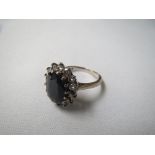 One dark blue sapphire and diamond cluster ring set in 18ct white gold, sapphire weight approx 5cts