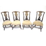 Four Iberian beechwood and parcel gilt dining chairs, circa 1760, with carved pierced splat,