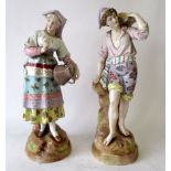 Pair continental figurines of a boy and a girl carrying vessels 33 cm H Condition: both good .