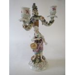 Continental porcelain 3 branch floral candelabra of a maiden with basket 32 cm H Condition: losses