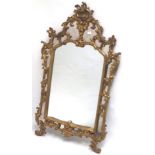 Ornate Rococo style gilt framed wall mirror overall 138 cm H x 73 Condition: Good .