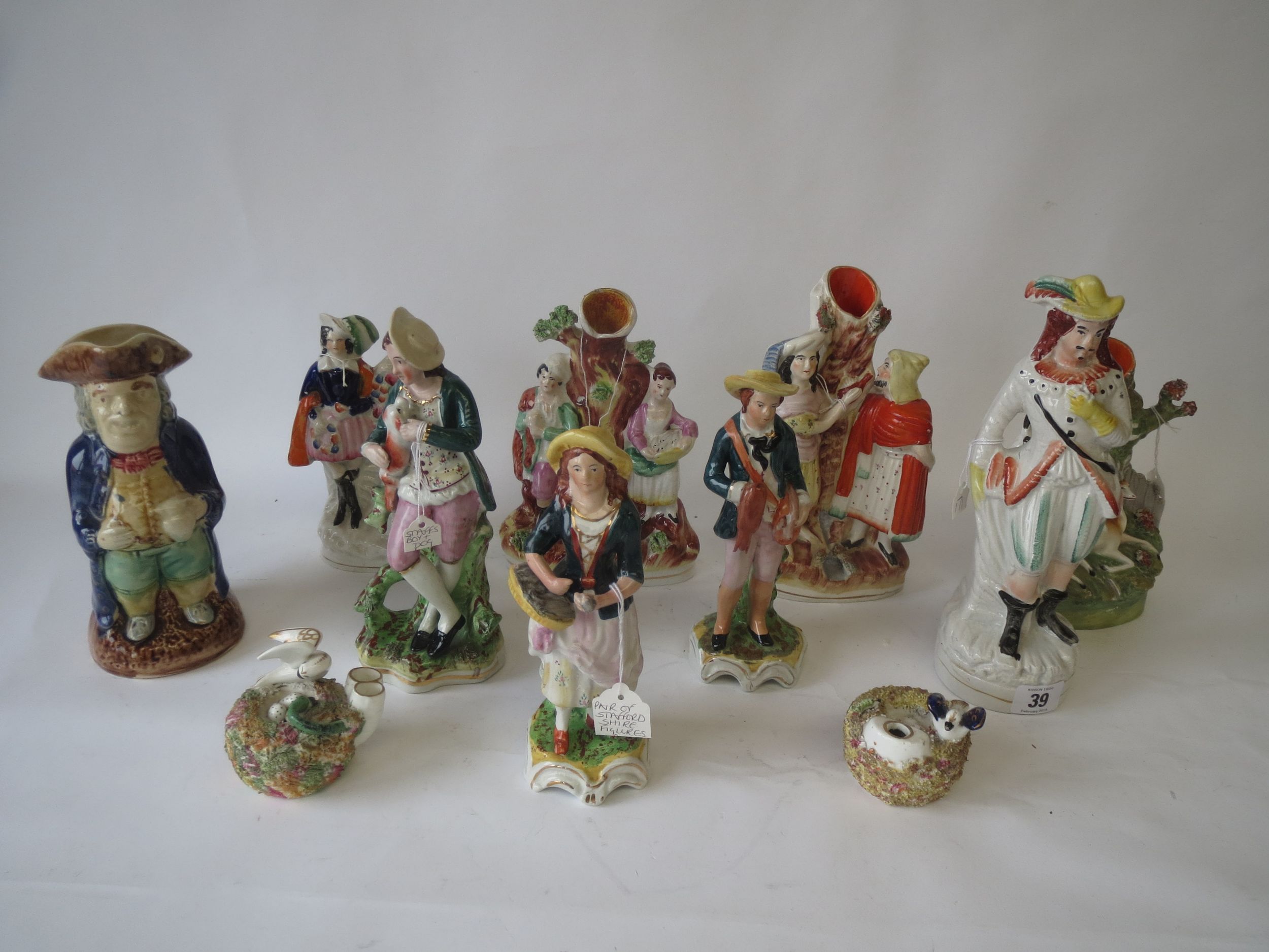 10 various Staffordshire flat back & other figures, spill vases and 1 Toby jug Condition: various