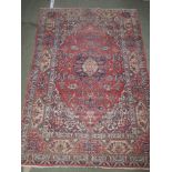 C19th English rug, with dark blue & beige decoration to a red ground 230 cm x 150 Prov: From the