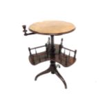 Victorian walnut smoker's reading table, the circular top with book tray beneath on a tripod base,