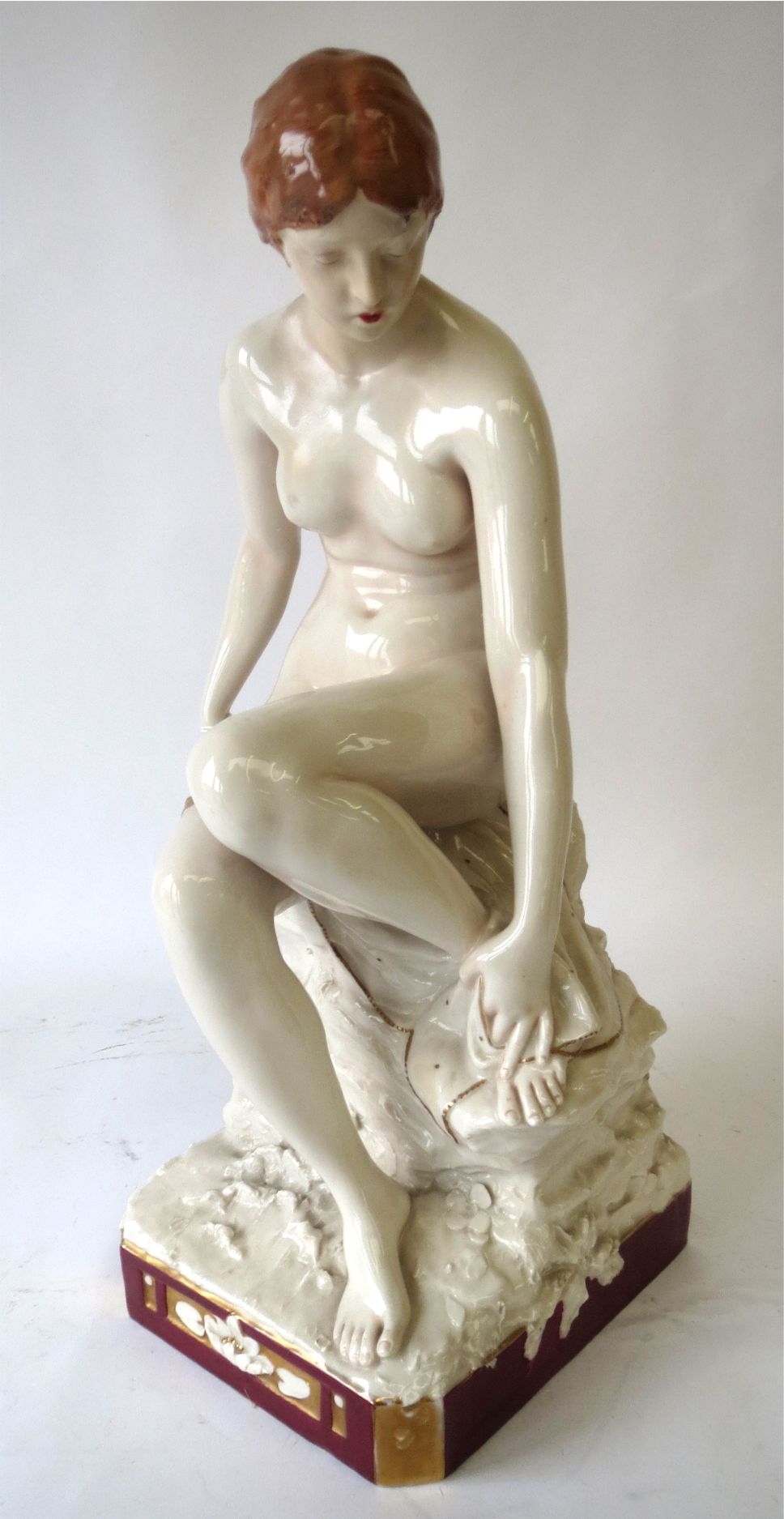 Royal Dux glazed figure of a seated nude 48 cm H Condition: restored head