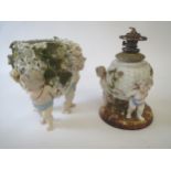 Continental encrusted floral porcelain cherub, a trio vase and a similar oil lamp Condition: very