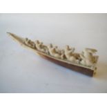 Oriental Ivory model of a boat being rowed by four rabbits, another rabbit as cox giving orders,