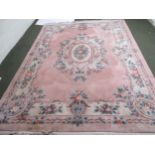 Chinese washed carpet, florally decorated to a print ground  376 x 275 Condition: Fair . but