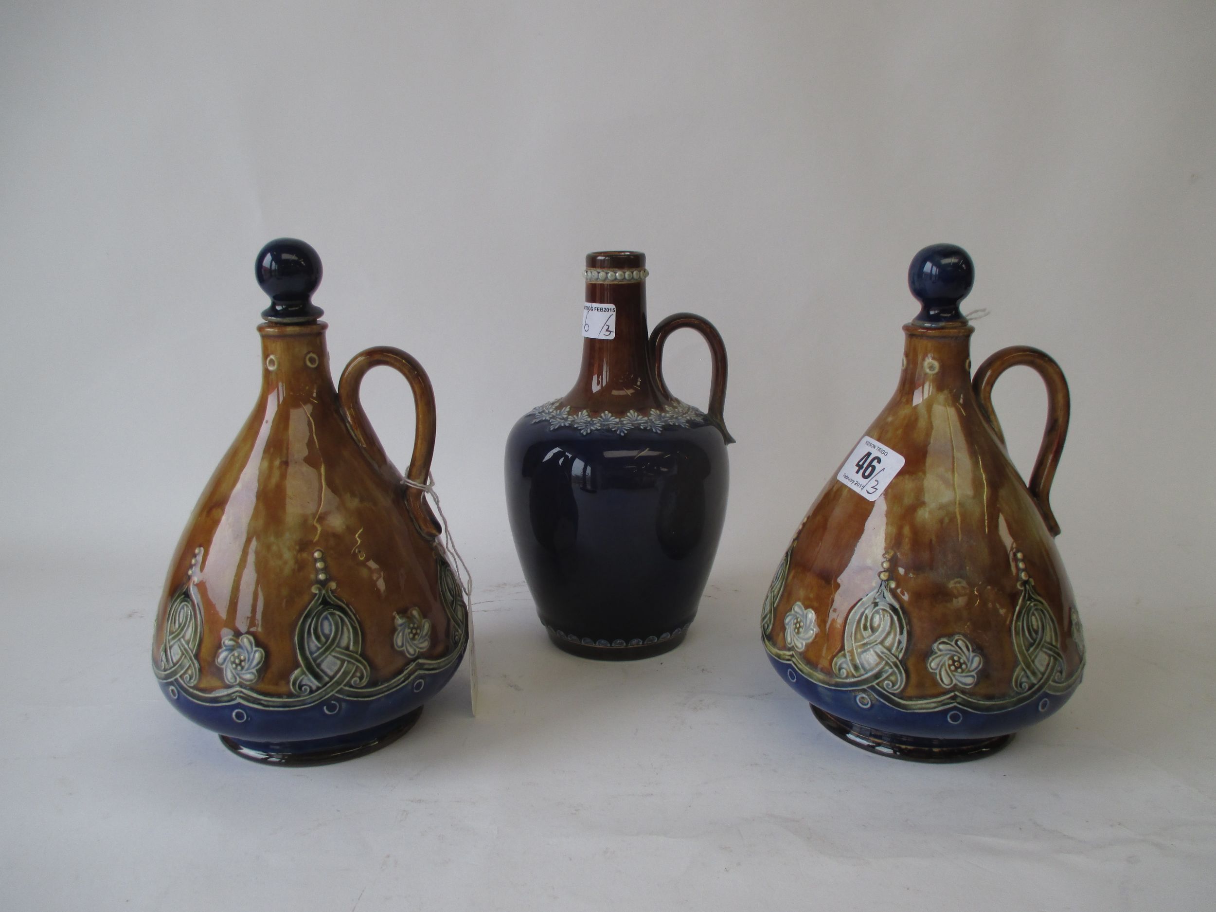 Pair Royal Doulton brown and blue glazed flagon & stoppers James Barrough Ltd Condition: Minor