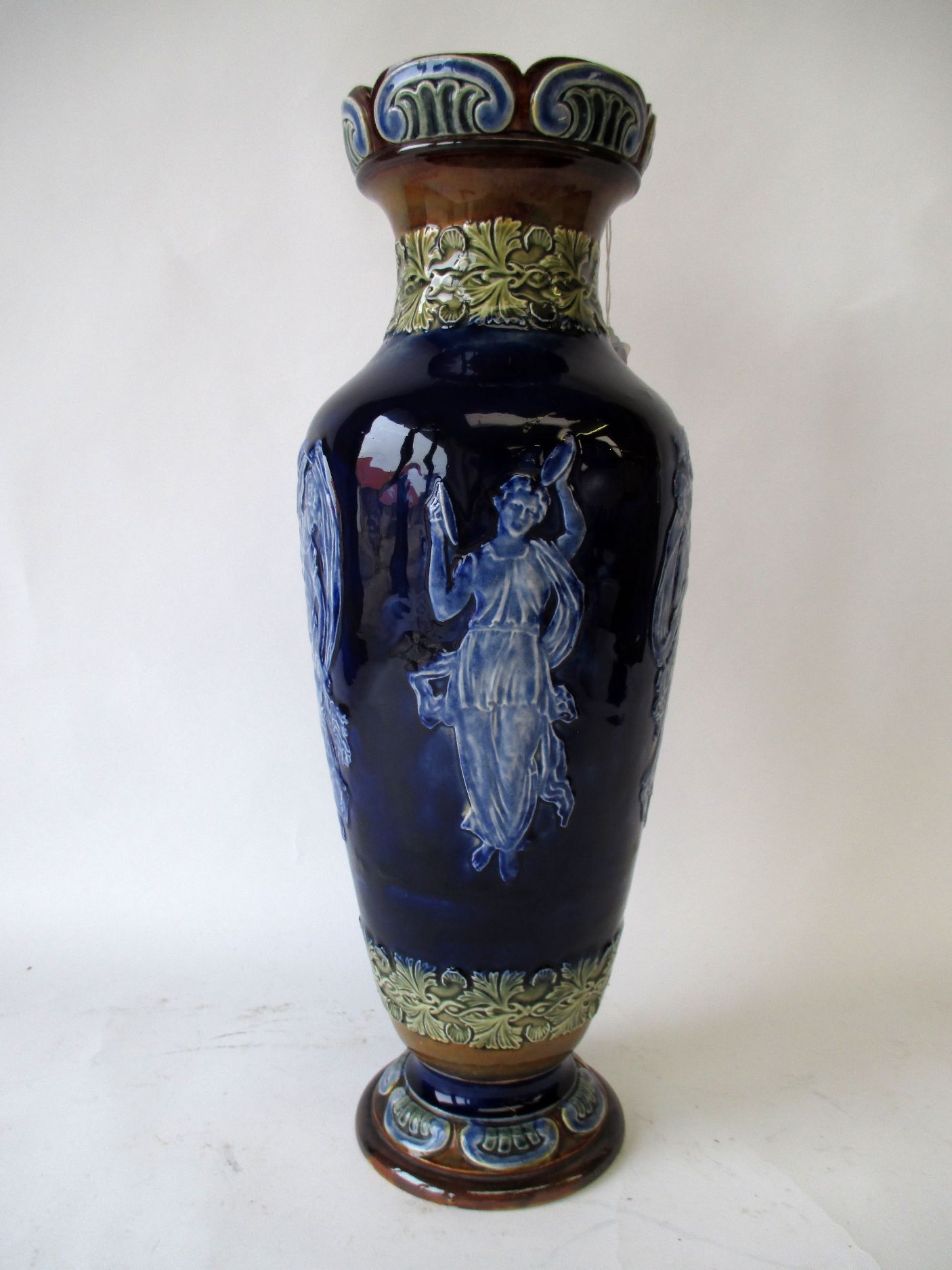 Doulton Lambeth blue ground vase decorated with classical figures, sgd 44 cm H Condition: good .