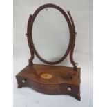 George III mahogany serpentine three-drawer box mirror with oval plate, 57cm W Prov: From the estate