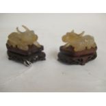 Pair Chinese C20th agate animals 6cmL on wood stands Condition: loss to horn