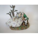 Early C19th Meissen crinoline group of lovers beneath a  tree, 30cm W Prov: From the estate of a