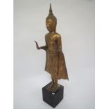 Gilt metal temple figure on wooden base  119 cm W Condition: in fair . for use/some marks