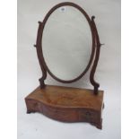 George III mahogany and marquetry inlaid three drawer serpentine box mirror with oval plate,