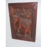 Oriental carved hard wood panel 'elephant with howdah and three riders' and black lacquer desk