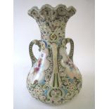 Victorian china tyg with prolific raised decoration and 3 floral panels 31 cm H Condition: