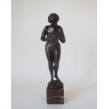 Bronze figure of a naked female holding a butterfly mounted on a marble base signed by W NITSNE 24x4