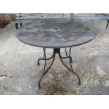 Circular black marble effect garden table some cracks and wear