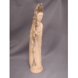 Japanese carved ivory okimono as a woman in traditional costume holding a branch with rope, 32 cm L