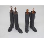 Pair black leather riding boots by Maxwell of London with trees and one other pair black boots