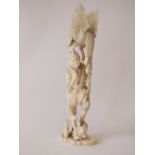 Japanese ivory okimono carved as a standing fisherman with eagle perched upon his shoulder with fish