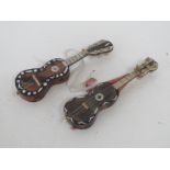 Two miniature tortoiseshell guitars with mother of pearl inlay