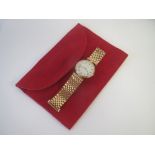 Cartier lady's 18ct gold wrist watch, circa 1990's, with three colour gold bezel and lugs, 24mm