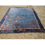 Chinese dark blue rug, with floral decoration.  410 x 335