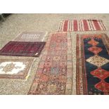 Six decorative rugs including two runners all with stylised decorative patterns 330x129, 385x107,