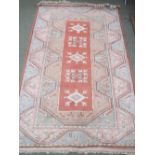 Persian style bugundy background rug with geometric pattern and 1 other