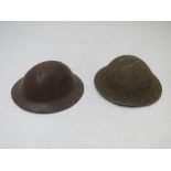 Two military tin hats