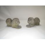 Pair of reconstituted concrete Lions, lying down, well aged and weathered