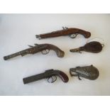 3 reproduction pistol and powder flasks and antique leather and brass powder flas