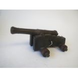 Miniature bronze barrel starting cannon on wooden trolley 20 L x 8H