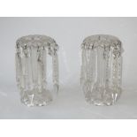 A pair of clear glass table lustres with prism and pendant drops