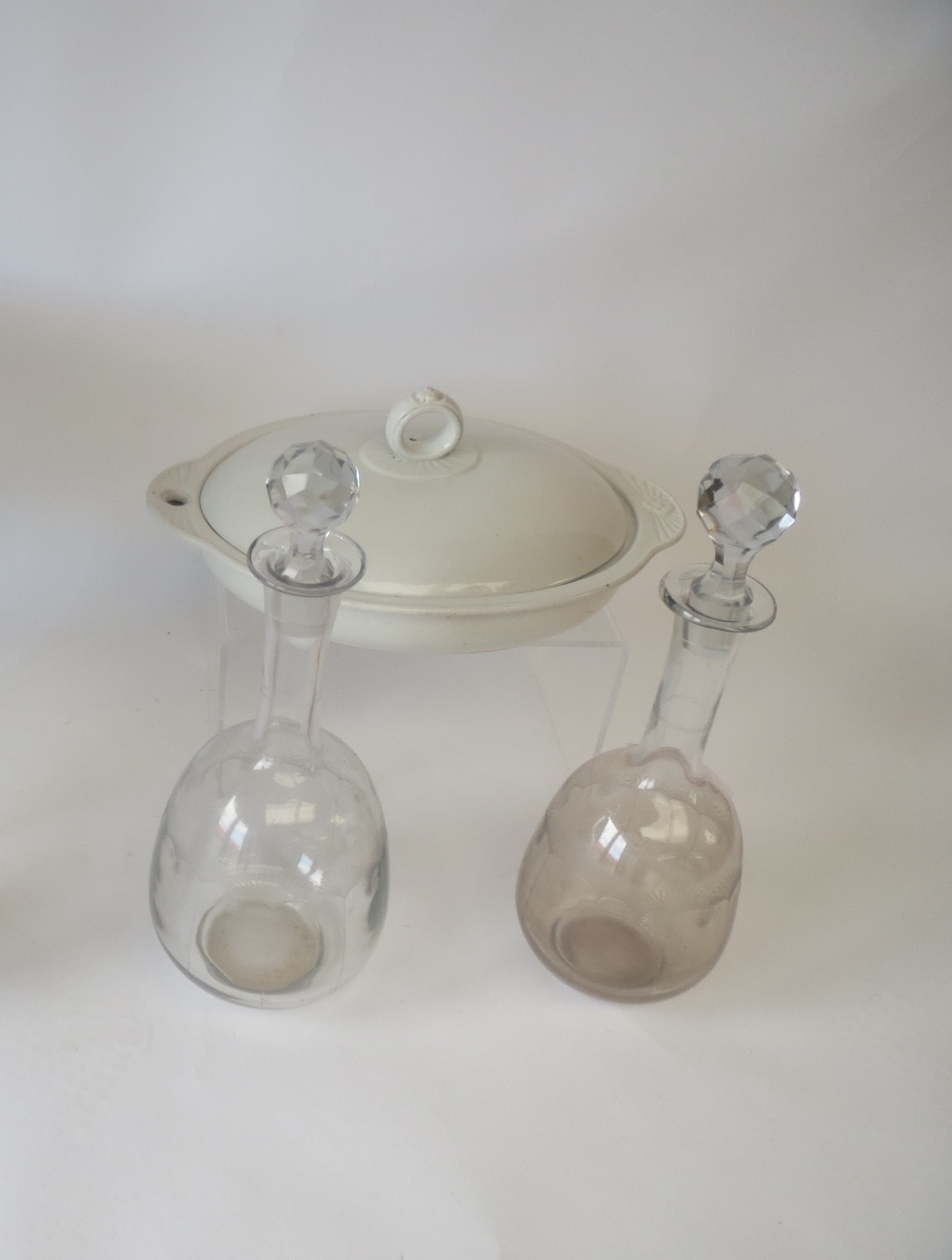 Two french glass hand blown decanters and stoppers, and a Wedgwood pottery gravy warmer with tree