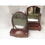 Early C19th mahogany bowfront toilet mirror with freize drawer, and another similar c.1900 mirror